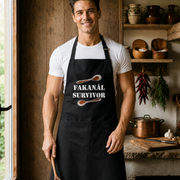Fit clean-shaven Hungarian man wearing the Fakanál Survivor apron in a rustic kitchen