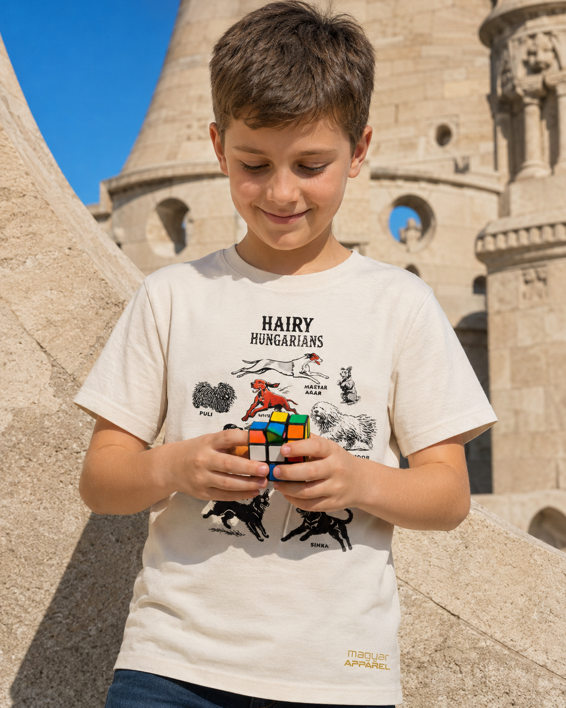 Boy wearing Hairy Hungarians youth T-shirt while playing with a Rubik's Cube